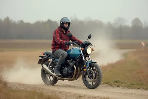 Honda NC750x, production year 2023, Mat Jeans Blue Metallic color, rides along a dusty road between fields. Driver is a slim european 35-years-old man with black hair and short beard, he wear a open m