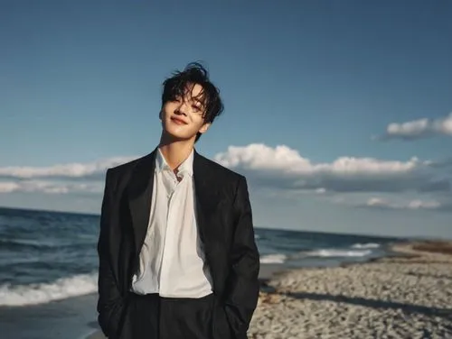 At the beginning of the video, the subject in the image stands naturally, facing the camera. Then, it slowly turns around. At the exact moment when its back is to the camera, the transformation begins