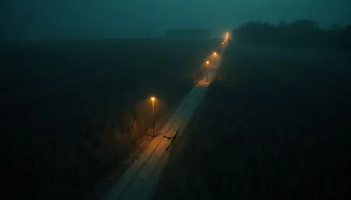 dark random scene from horror movie,country,rednex,corn ,an aerial po shows long - distance light traffic as fog and mist loom in the background,ground fog,dense fog,foggy landscape,nacht,fog,light tr