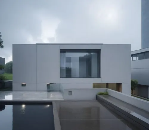 a large modern building with a water pool in front,modern house,cube house,modern architecture,chipperfield,cubic house,cantilevers,corbu,cantilevered,asian architecture,archidaily,eisenman,frame hous