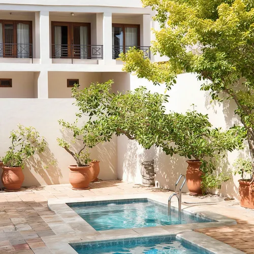 a classic courtyard villas, sustainable modern design in the middle eastern region,a nice house with a pool in it,courtyards,courtyard,inside courtyard,holiday villa,patio,guesthouses,private house,pa