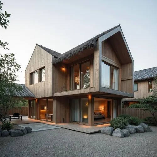  ,the exterior view of an elegant home with many windows,timber house,wooden house,dunes house,modern house,forest house,bohlin