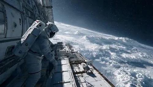 An astronaut is performing maintenance work outside the space station. The camera pulls back to reveal the space station floating in the vast expanse of space, presenting a scene in a science - fictio