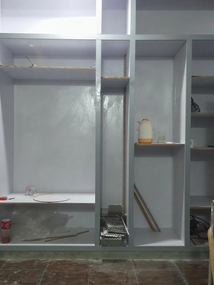 an empty white closet is shown with shelves