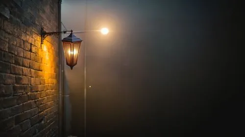 a street light on a brick building and wall,lamplight,gas lamp,street lamp,street lamps,iron street lamp,streetlamps,streetlamp,street light,streetlight,street lantern,outdoor street light,hanging lig