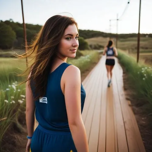 woman in blue outfit walking away from the camera,blue dress,wooden track,female runner,girl in a long dress,girl in a long dress from the back,boardwalk