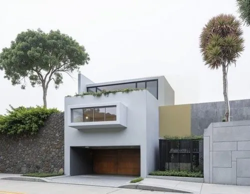 MURO CON  Pintura Color Mica Arena Del Desierto,a modern style building has garage doors and windows,modern house,residential house,dunes house,modern architecture,cubic house,mid century house,cube h