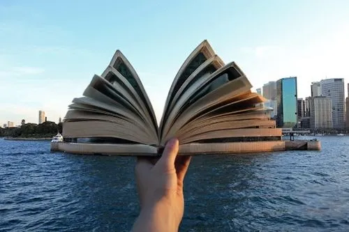 a hand holding an opening book,spiral book,sydney opera house,bookbuilding,sydney harbour,sydney opera,book pages,sydneyharbour,turn the page,magic book,library book,book wallpaper,encyclopaedias,book
