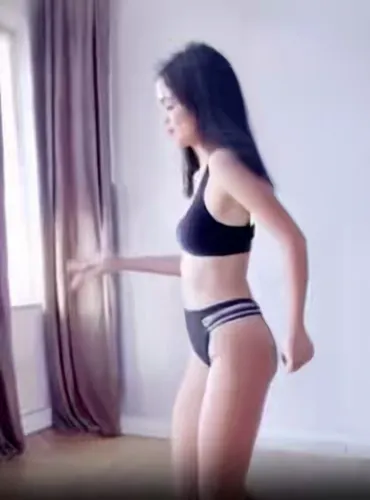 Create a video in which a young girl performs energetic breakdancing moves in a daylight loft studio. The focus is on her athleticism and stylish dance routine, including spins, flips and freezes.,mac