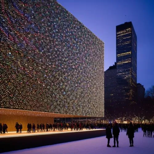 Bjarke Ingels design architecture plaza with christmas light all over the architecture in New York City experience designed to be entered and explored. Explore how distinct architectural styles can be