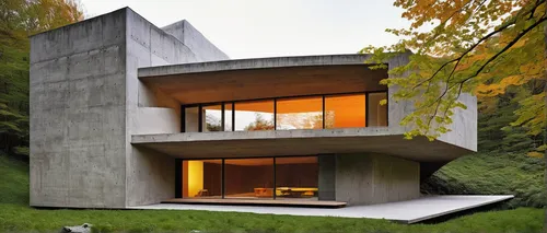 Achieve a minimalist feel with neutral colors and clean lines,cubic house,cube house,modern architecture,modern house,exposed concrete,dunes house,concrete construction,frame house,house shape,corten 