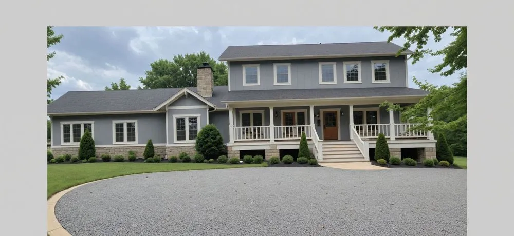 a large grey house with white stairs