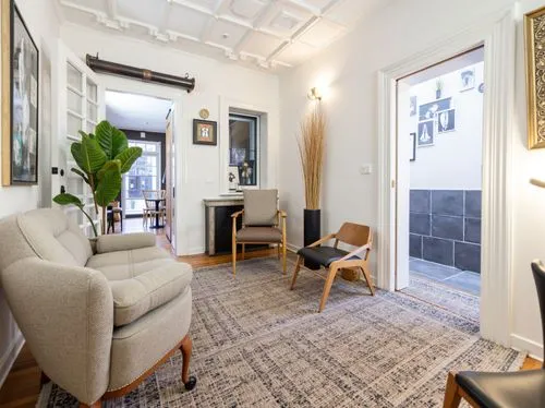 a clean and organized living room with furniture,shared apartment,homes for sale in hoboken nj,hoboken condos for sale,apartment lounge,home interior,homes for sale hoboken nj,rowhouse,appartement,con