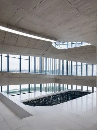 Achieve a minimalist feel with neutral colors and clean lines,concrete ceiling,aqua studio,exposed concrete,autostadt wolfsburg,concrete construction,infinity swimming pool,dunes house,archidaily,refl