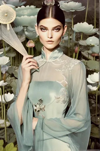 A female model in a translucent Qing Dynasty inspired dress, holding a delicately carved jade fan, an extra-long shot set in a serene moonlit garden adorned with blooming lotuses, captured in the styl