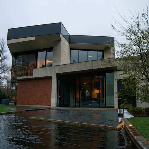 1building,a very modern house that has been raining outside,corten steel,aqua studio,modern house,gemeentemuseum,cube house,adjaye,cantilevered,ruhl house,modern architecture,vmfa,minotti,bunshaft,hal
