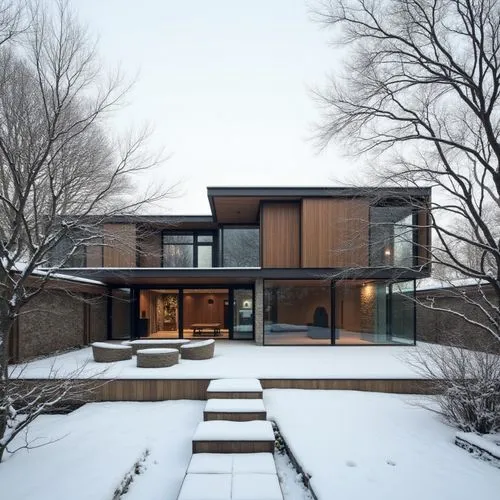  ,a house covered in snow and trees,timber house,winter house,bohlin,mid century house,wayzata,ruhl house