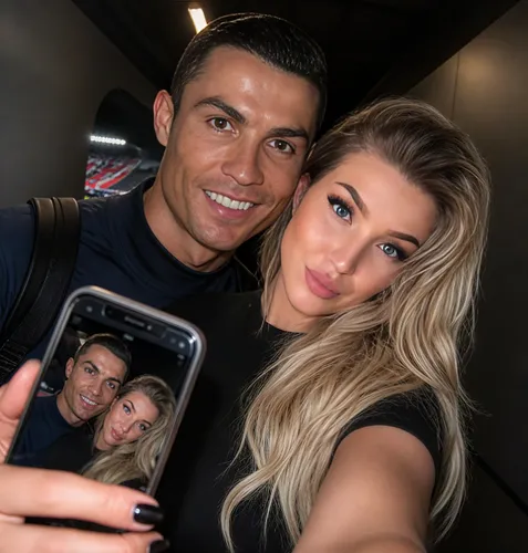 a young woman is taking a selfie with a man,adores,beautiful couple,superstars,couple goal,footballers,love couple,supermodels,photo camera,cracks,celebs,goalscorer,legends,footballer,mom and dad,edit