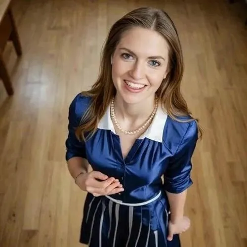 Mathilde is French, Shekneels down to the ground then adjusts her hair and asks with her smile and alluring eyes in her cute little French voice: "tu as bien retenu la leçon ?",blue dress,waitress,apr