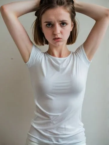 a nice English 28-y-o girl in white is holding her head while she stands,a young woman posing with her hands on her hair,girl in t-shirt,cotton top,white shirt,teen,caterino,tshirt