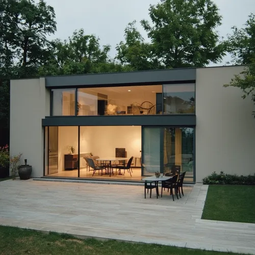 1building,a glass walled house has an outside table,modern house,vitra,passivhaus,danish house,lohaus,eisenman,dinesen,cubic house,minotti,architektur,residential house,house shape,modern architecture