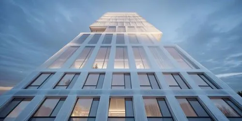 a high rise building in the evening with many windows,impact tower,residential tower,steel tower,electric tower,the energy tower,renaissance tower