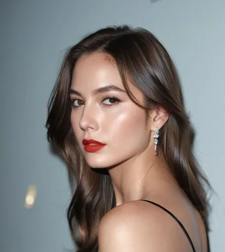 a close up of a beautiful young caucasian woman 23 years old, long brown hair, brown eyes red lips, wearing a elegant black dress, she is sitting in a seat in a teather, she is looking back, turning h