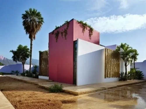 PORTON DE MADERA
,a house with plants on the side and two palm trees,cubic house,cube house,cube stilt houses,dunes house,model house,cabanas,pilgrimage chapel,hacienda,aqua studio,clay house,holiday 