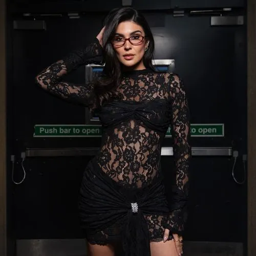 a woman wearing glasses posing in a black dress,black and lace,photo session in bodysuit,fashion shoot,librarian,secretarial,dress walk black,black background,vintage lace,fir shoot,mesh and frame,lac