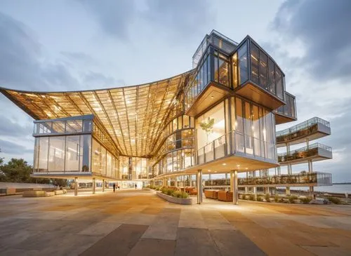 the exterior of a modern office building with its own patio,cube stilt houses,glass facade,glass building,modern architecture,cubic house,glass facades,cube house,futuristic architecture,futuristic ar