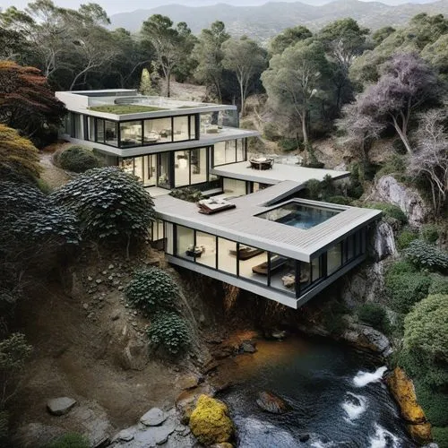the large house is surrounded by an area of mountains and forest,dunes house,cube house,cubic house,mid century house,modern house,forest house