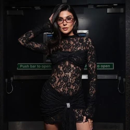 a beautiful young woman posing for the camera,black and lace,photo session in bodysuit,fashion shoot,librarian,black background,secretarial,dress walk black,fir shoot,lace,lace round frames,royal lace