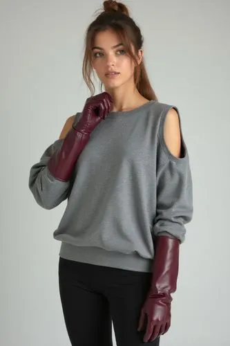 An 18-year-old woman wears an oversized grey sports sweatshirt with cut-off sleeves at the elbow, underneath which her burgundy leather gloves are stretched up to the shoulders, fully visible and glos