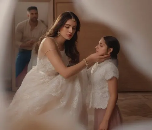 a woman standing next to a young man, in front of a window,vaanii,kareena,kriti,genelia,vaani,shivdasani