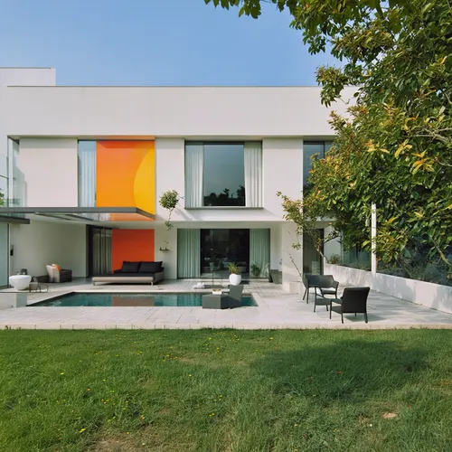 1Building,the house has lawn, pool and chairs on it,modern house,mid century house,cube house,cubic house,bauhaus,modern architecture