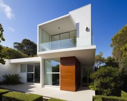 VEGETACIÓN 
,a white house with wood and glass in the garden,modern house,modern architecture,cube house,cubic house,dunes house,fresnaye,cantilevered,landscape design sydney,seidler,contemporary