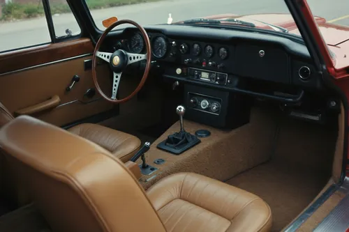 a car with the dash board on the dashboard,the vehicle interior,car interior,the interior of the,the interior of the cockpit,driver's cab,cockpits,interior,cockpit,dashboard,leather steering wheel,int