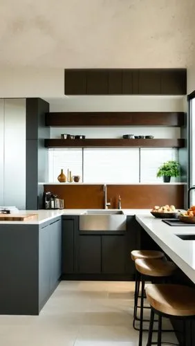 An indoor frontal view of a light colored kitchen, with a light colored wooden cabinetry and stainless steel stove on the right. The cabinets are white, with gray grout on the shelves. Below the cabin