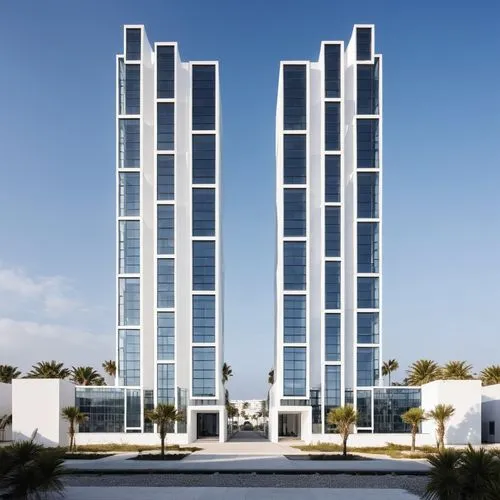 two tall buildings next to each other against a blue sky,skyscapers,residential tower,baladiyat,mubadala,escala,urban towers,Photography,General,Realistic