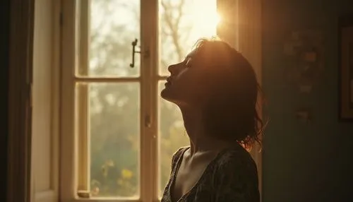 A young woman with eyes closed, head lifted slightly, standing in front of an open window filled with morning light. Octane cinematic tone.

,a woman is staring out the window of her house,woman silho