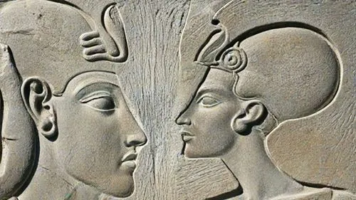 two ancient looking heads with different symbols on them,sarcophagi,heads,sculptures,sarcophagus,the sculptures,friezes