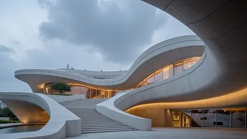 A high-resolution, hyper-realistic architectural photograph capturing a striking, futuristic, multi-level ecotourism complex constructed primarily of smooth, exposed concrete. The design is characteri