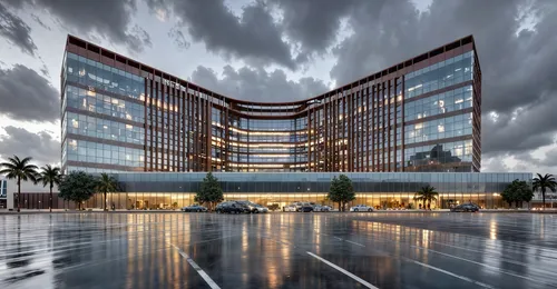straight  edges , bright sky, God rays ,a po of an office building on a dark and rainy day,office building,headquarter,glass facade,office buildings,biotechnology research institute,company headquarte