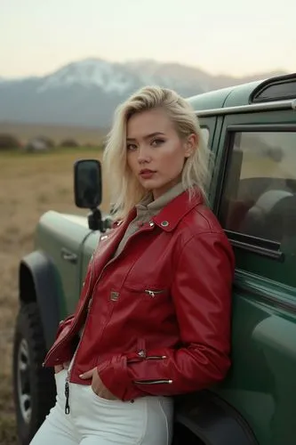 Crew cut, blondi woman leaning against the three holding a red lipstick, red leather jacket, white pants, square face, green off-road vehicle, distant mountains, backlighting, large aperture.


,a wom