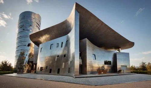 two buildings in a parking lot near each other,futuristic architecture,modern architecture,futuristic art museum,cube house,metal cladding,cubic house,glass facade,modern building,glass building,steel