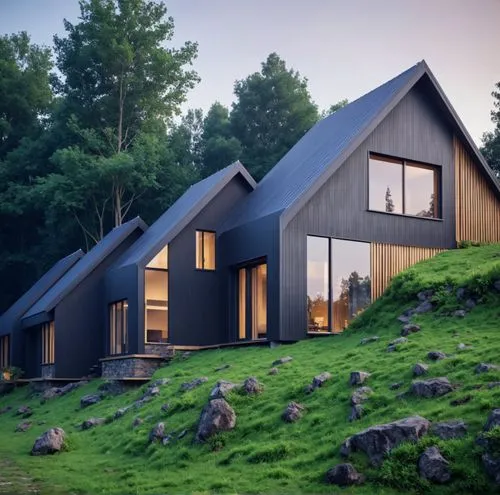 a hillside that is home to three cabins,timber house,cubic house,forest house,house in mountains,house in the mountains,cube house,inverted cottage,dunes house,the cabin in the mountains,grass roof,lo