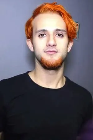 Orange hair and beard,a man with orange hair wearing black with scissors,dwane,neck,rongjuan,half orange,mutarelli,gingrichian