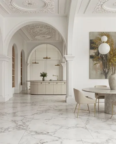 A luxury modern kitchen design with a marble kitchen island and detailed molding on the ceiling. The floor is polished white marble with dark veins. The furniture includes beige velvet chairs with gol