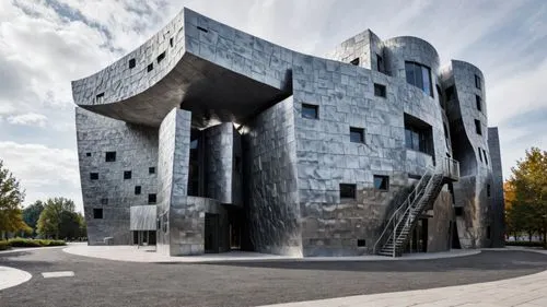 a grey brick building with some stairs on one side,cubic house,cube house,climbing wall,modern architecture,chancellery,architecturally,futuristic architecture,concrete blocks,concrete plant,cube stil