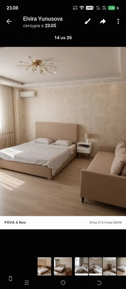 an open bedroom with a bed and a couch